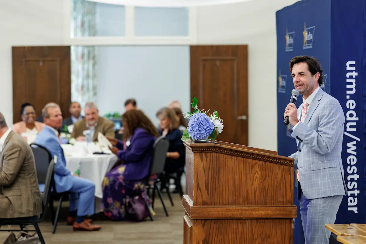Jake Bynum presenting to a WestStar Leadership Program graduates at the graduation ceremony.