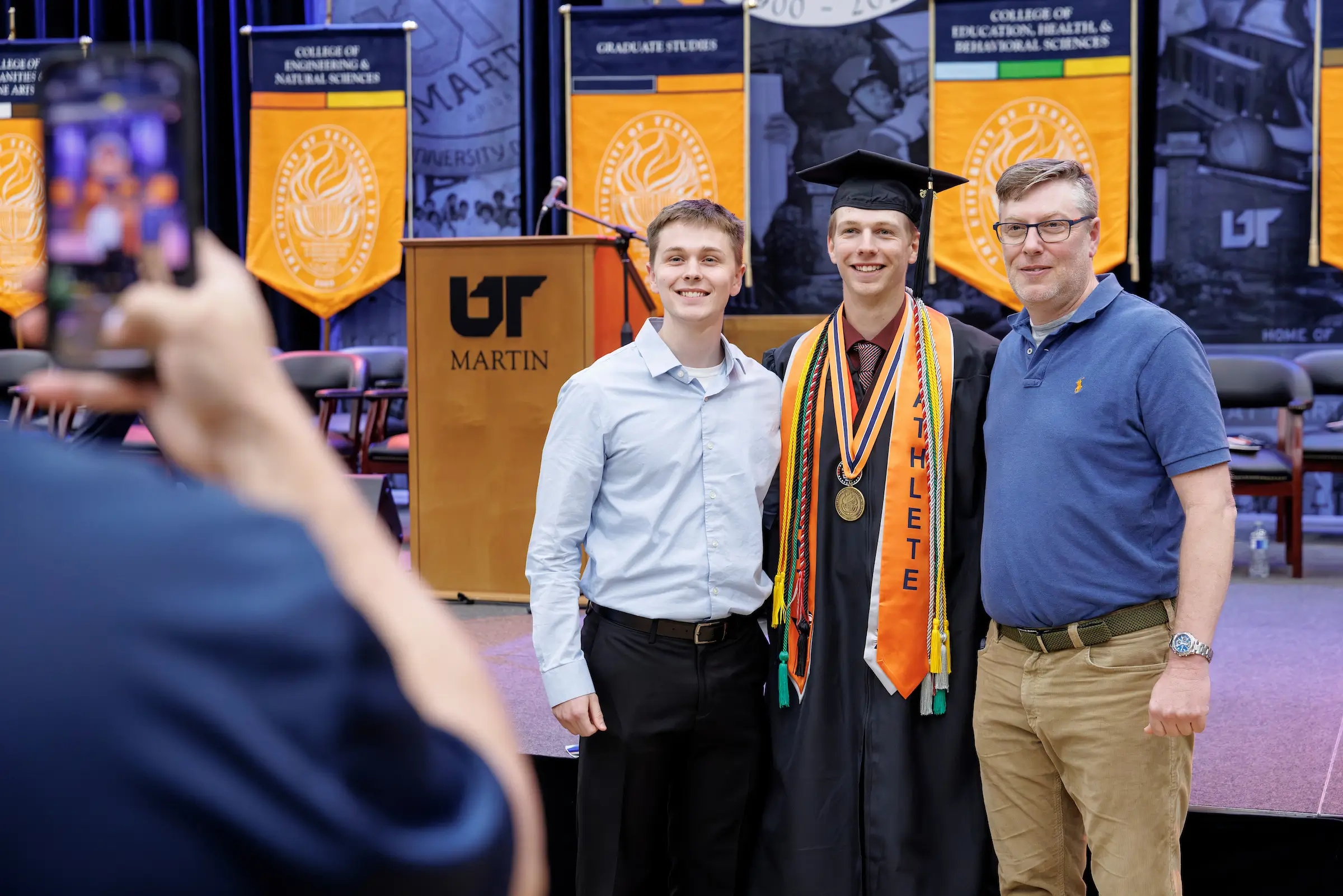 Families celebrate their Skyhawk at commencement.