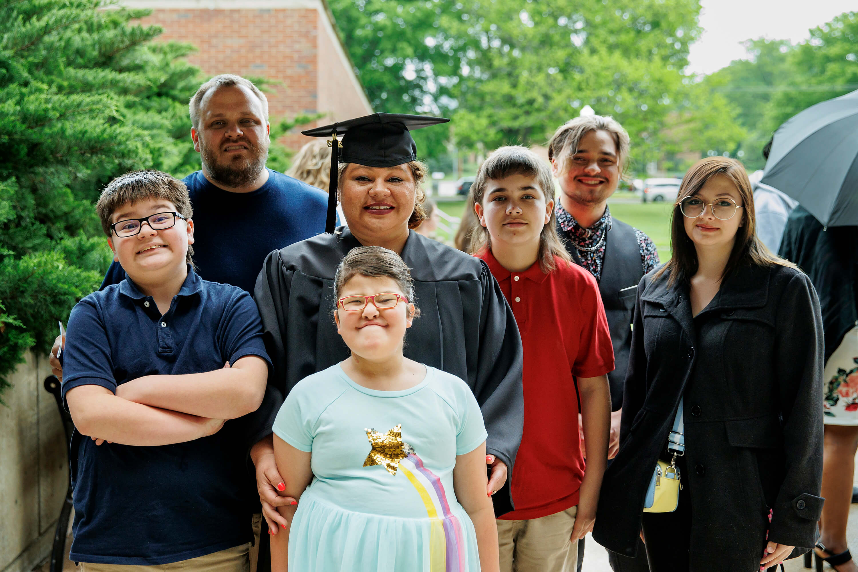 Celebrating her achievement were (back row) husband, Barry, and son Kayden Neal; (front row l, r) son Elijah Neal, Jennings, son Kyren, daughter-in-law, Lillianna Morgan; and (front) daughter, Adyson.