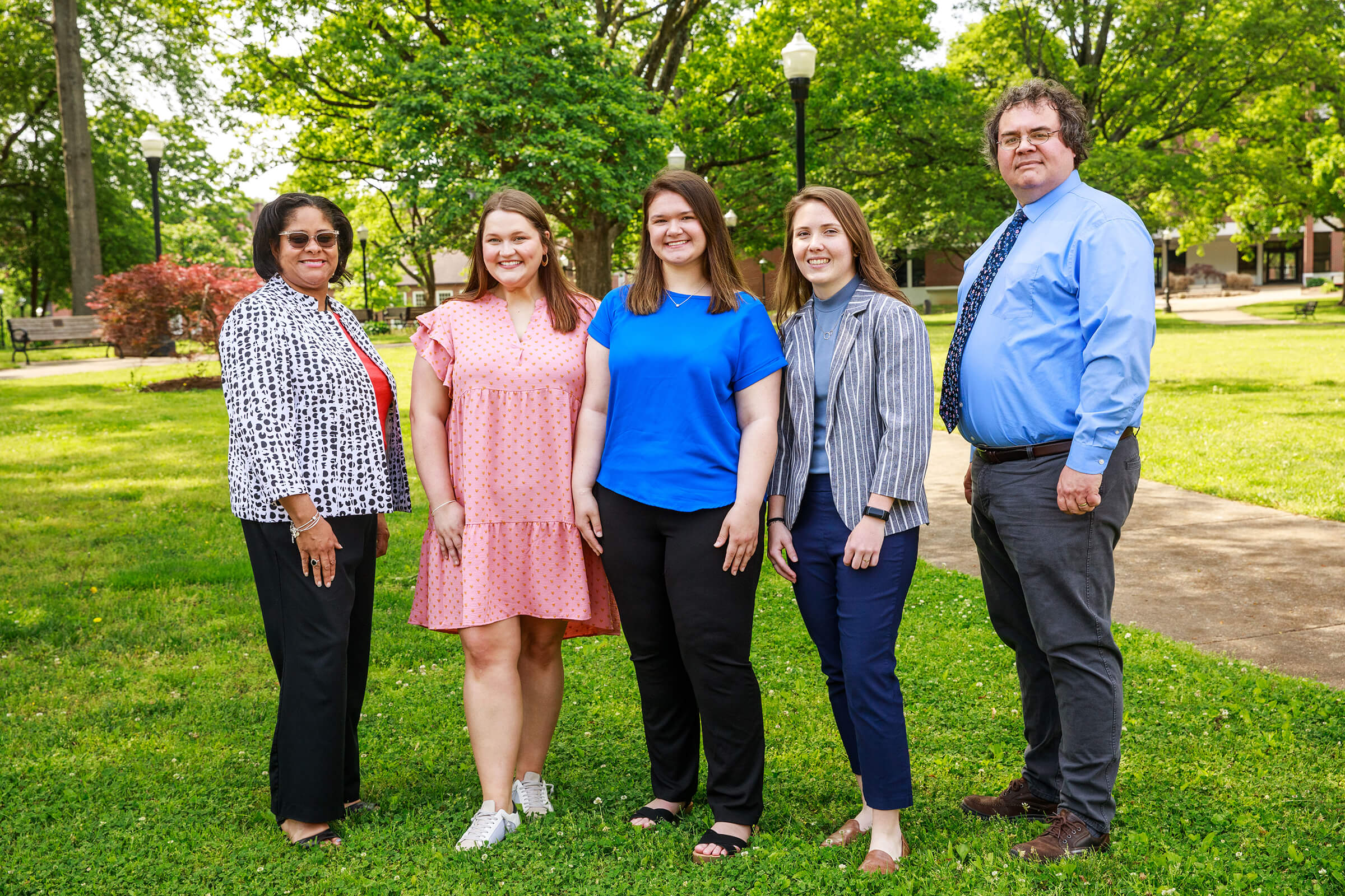 Ms. Petra McPhearson (far left) and Dr. Steve Elliott (far right), welcome three new Scholars, (left to right) Ms. Abby Webb, Ms. Kaitlyn Marrs, and Ms. Taylor Overcast.